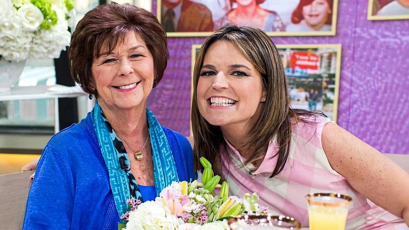 Nancy and Savannah Guthrie smiling at a decorated table.