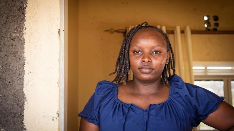 Reproductive health and oncology nurse Faith Nelima outside the dispensary at Lokichar Girls Secondary School. Image by Christopher Clark for Mongabay.