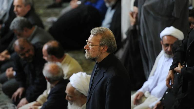 Ali Larijani stands during prayers in Tehran on July 10, 2015.