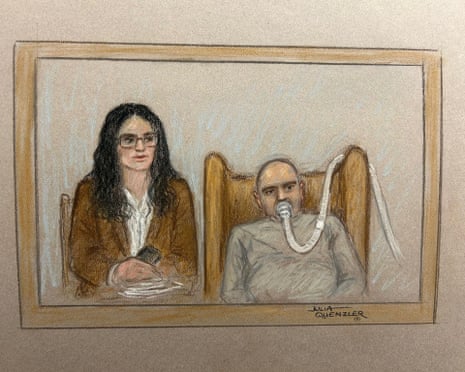 Former Syrian colonel Salem Al-Salem appears in court via videolink with a breathing tube over his mouth