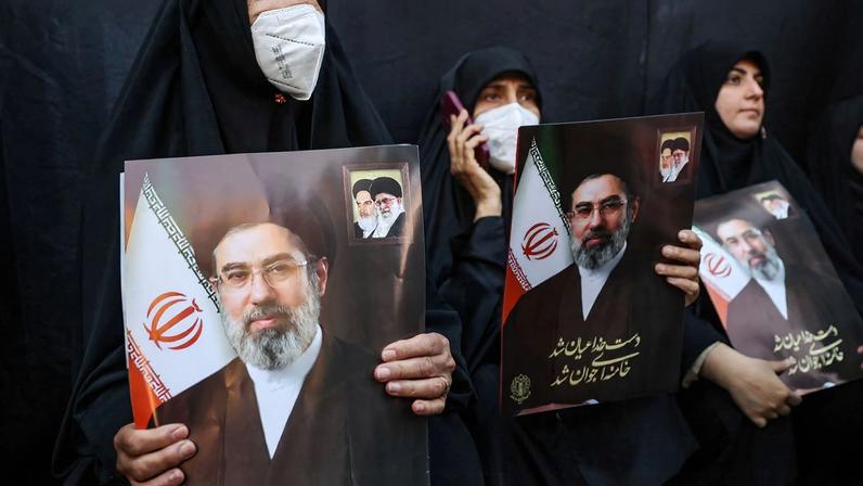 People hold placards with images of Iran's new supreme leader Mojtaba Khamenei during a gathering to support him, amid the U.S.-Israeli conflict with Iran, in Tehran, Iran, March 9, 2026. Majid Asgaripour/WANA (West Asia News Agency) via REUTERS ATTENTION EDITORS - THIS PICTURE WAS PROVIDED BY A THIRD PARTY