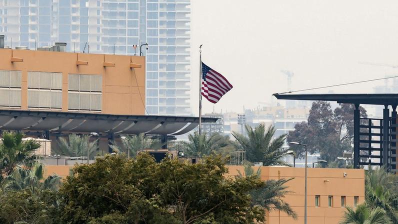 The U.S. flag flies at the U.S. Embassy, after Iraqi security sources said the embassy was hit in a missile attack, in Baghdad, Iraq, March 14, 2026. REUTERS/Ahmed Saad
