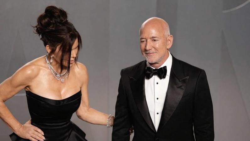 Lauren Sánchez was caught shooing away her hubby, Jeff Bezos, while on the Vanity Fair Oscars Party 2026 red carpet.