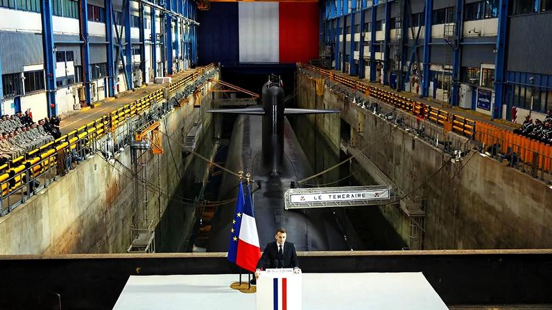 France's President Emmanuel Macron delivers a speech next to nuclear-powered ballistic missile submarine (SSBN) submarine "Le Temeraire"