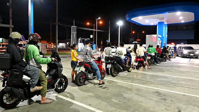 Motorcycles queuing at a petrol station in Bangkok, as motorists scrambled to beat a massive fuel price increase, 26 March 2026.