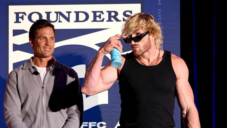 Tom Brady and Logan Paul took shots at each other — again! — during the Fanatics Flag Football Classic Draft in Beverly Hills, Calif., Wednesday night (pictured together above from the event).