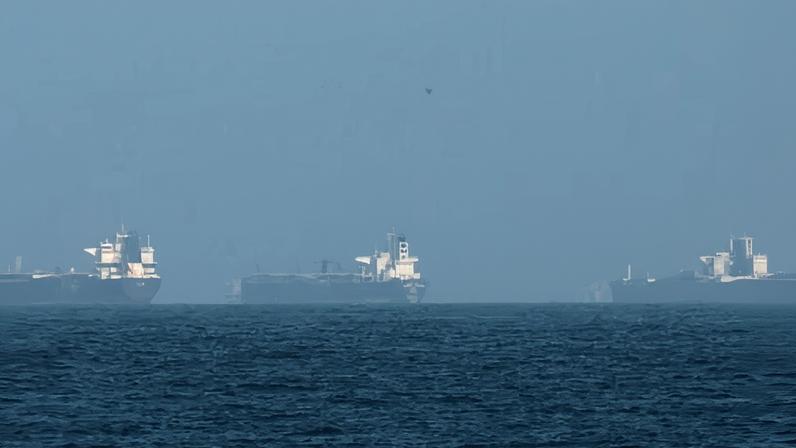 Oil tankers in the Strait of Hormuz, off the coast of Iran. About a fifth of global oil supplies pass through the strait and it has been in effect closed since the weekend.
