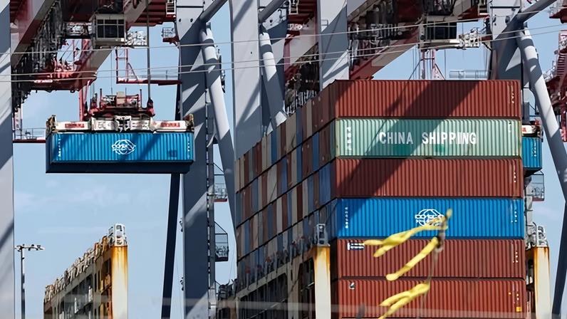 Shipping containers are stacked at the port of Los Angeles on 4 March 2026.