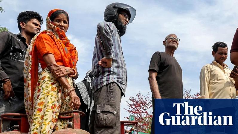People queue to refill their empty LPG cylinders in New Delhi. LPG is central to everyday cooking in India, where the impact of the supply crisis has been immediate.