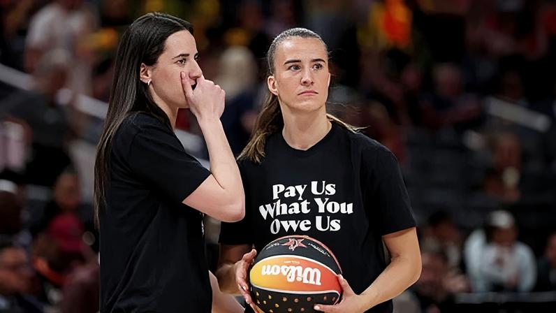 Caitlin Clark and Sabrina Ionescu wear shirts saying ‘Pay us what you owe us’ prior to last year’s WNBA All-Star Game at Gainbridge Fieldhouse.