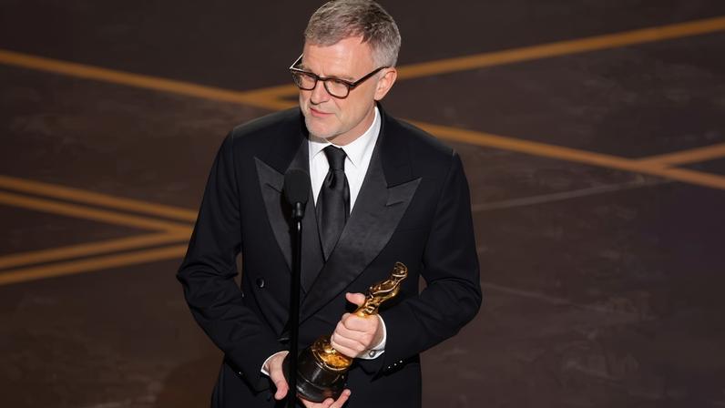 Paul Thomas Anderson wins the Oscar for best adapted screenplay for One Battle after Another at the 98th Academy Awards.