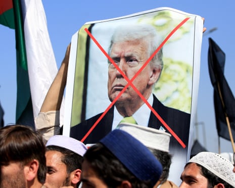 Protesters against the US attacks on Iran march through Peshawar, Pakistan, on Monday.