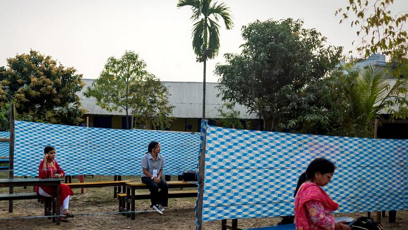 Polling officers rest after setting up a polling station at a school, ahead of general election, in Damak, Jhapa district, Nepal, March 4, 2026. REUTERS/Adnan Abidi