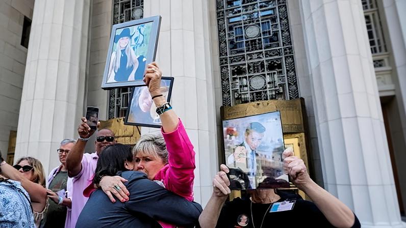 Families who accused Meta and YouTube of putting their children in the way of harm outside the court in Los Angeles, California on Wednesday.