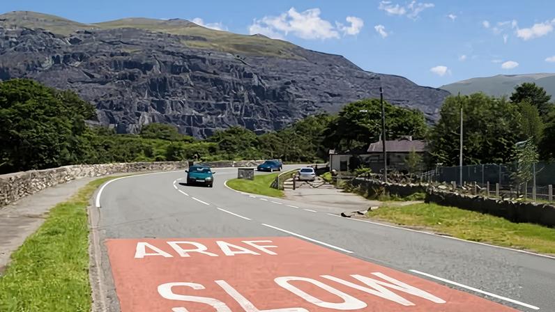 Bilingual road marking in Wales. The number of Welsh speakers has not risen in line with population growth, says Efa Gruffudd Jones’s report.