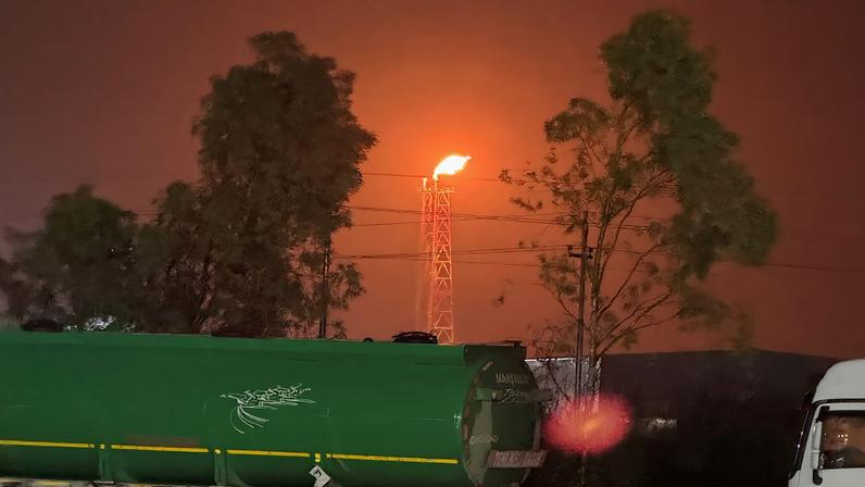 A gas flare burns at the Lanaz refinery after it was targeted by a drone strike, in Erbil, Iraq, March 14, 2026. REUTERS/Khalid al Mousily/File Photo