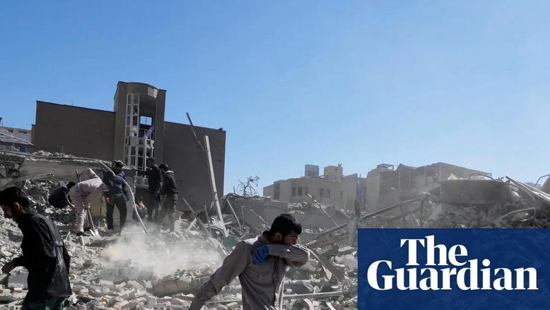 Iranians inspect the ruins of a police station struck by an airstrike in Tehran, Iran on Tuesday.