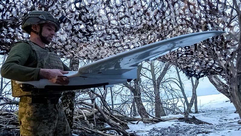 A Ukrainian soldier with a drone in the Kharkiv region.