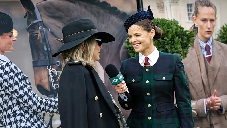 Jade Holland Cooper (right) conducts an interview for her TV channel at Cheltenham racecourse on Tuesday.
