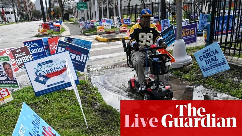 Campaign signs are seen near a polling location in Houston, Texas on 3 March.