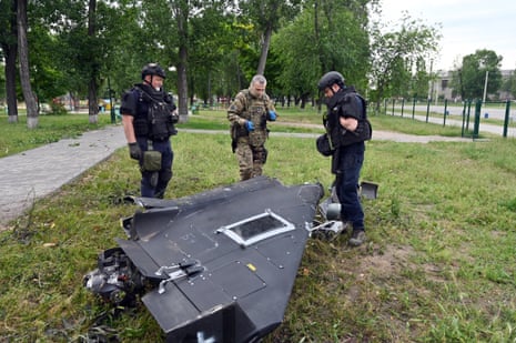 File image of Ukrainian experts examining the wreckage of a crashed Shahed 136 drone in Kharkiv park.