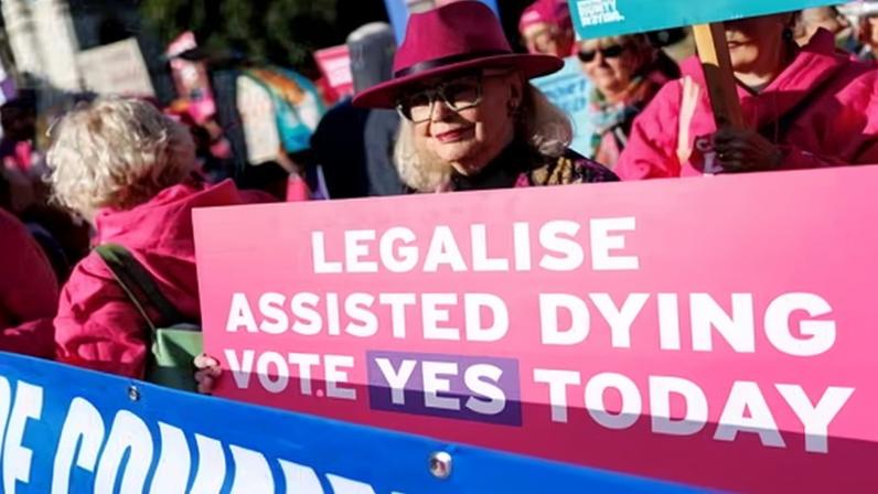 Pro-assisted-dying campaigners demonstrate in Parliament Square, London in September last year.