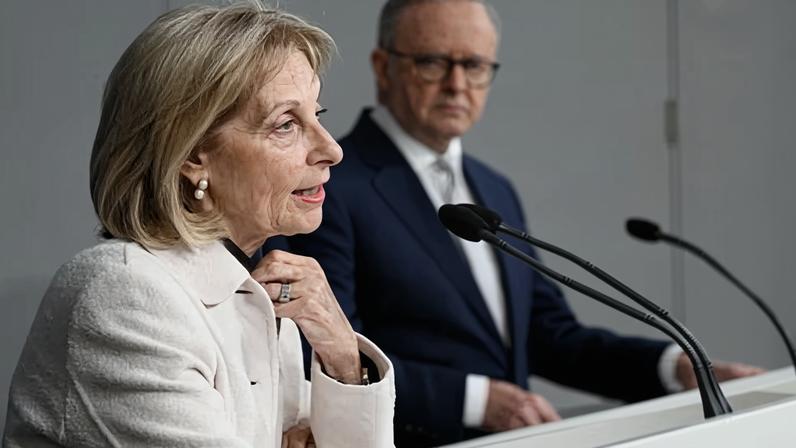 Jillian Segal speaking from a lectern with Anthony Albanese watching