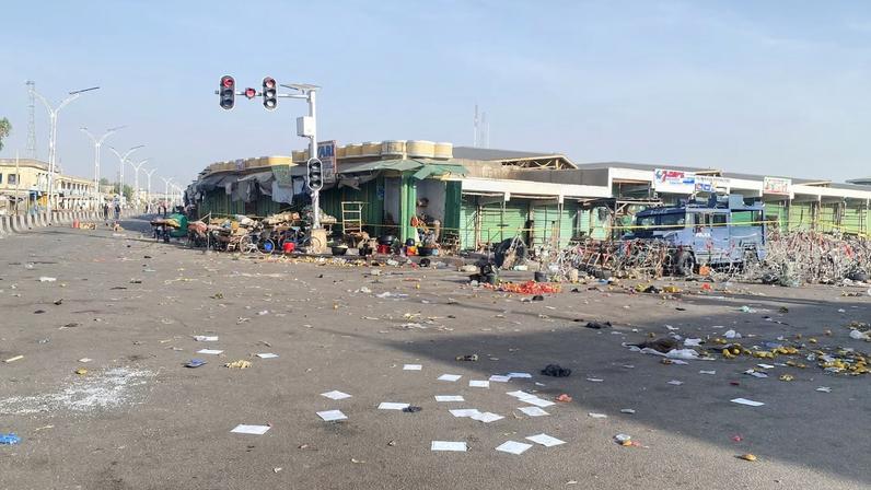 A Nigerian police truck stands at the deserted Maiduguri Monday Market, the morning after multiple explosions struck the northeastern city of Maiduguri, Borno State, Nigeria, March 17, 2026.