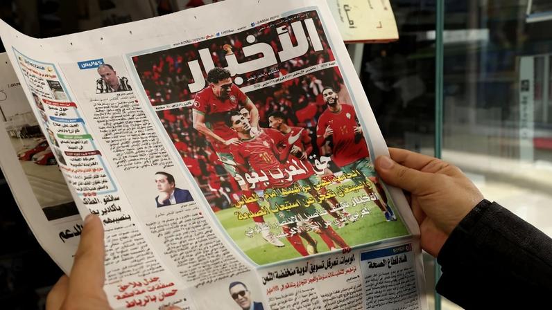A man holds a Moroccan newspaper in Rabat, Morocco, on March 18, following the Confederation of African Football’s decision to strip Senegal of its Africa Cup of Nations title.