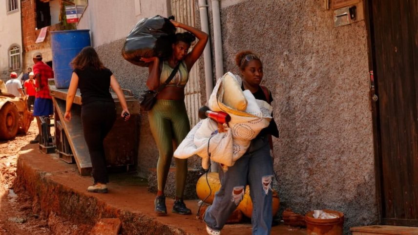 Residents carry away their belongings at the site where homes collapsed due to heavy rains and flooding in the Parque Burnier neighborhood of Juiz de Fora, Minas Gerais state, Brazil, Wednesday, Feb. 25, 2026. Photo courtesy of Silvia Izquierdo/ Associated Press