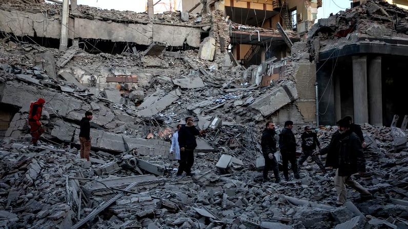 People stand in rubble at the site of an Israel and U.S. strike on a police station in Tehran, Iran, March 3, 2026. Majid Khahi/ISNA/WANA (West Asia News Agency) via REUTERS