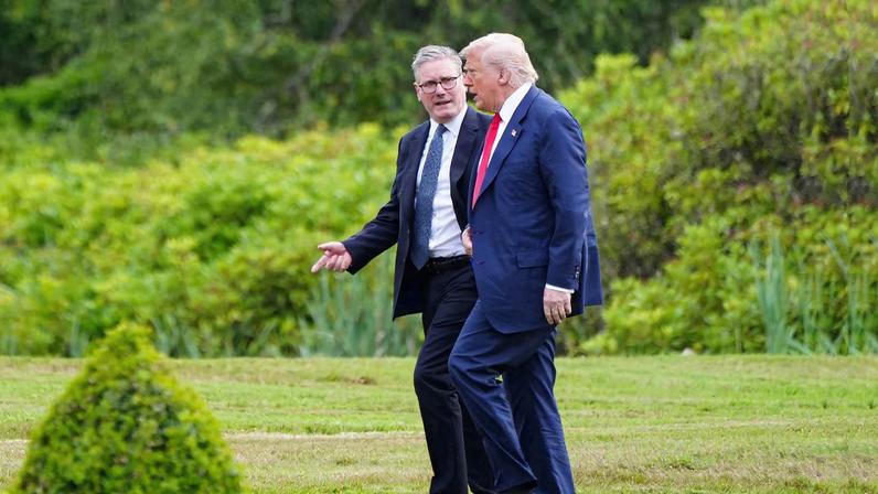 U.S. President Donald Trump walks with British Prime Minister Keir Starmer at Trump International Golf Links, in Aberdeen, Scotland, Britain, July 28, 2025. Jane Barlow/Pool via REUTERS/File Photo
