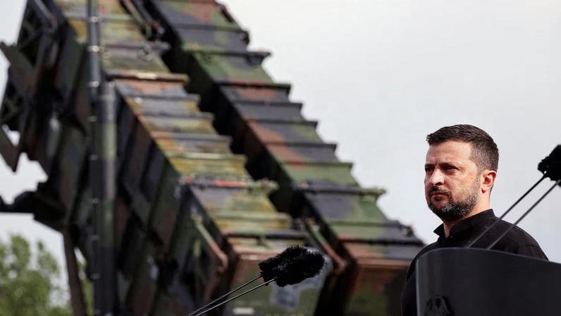 Ukrainian President Volodymyr Zelenskiy looks on during a visit to a military training area to find out about the training of Ukrainian soldiers on the “Patriot” anti-aircraft missile system, at an undisclosed location, in Germany, June 11, 2024. Jens Buttner/Pool via REUTERS