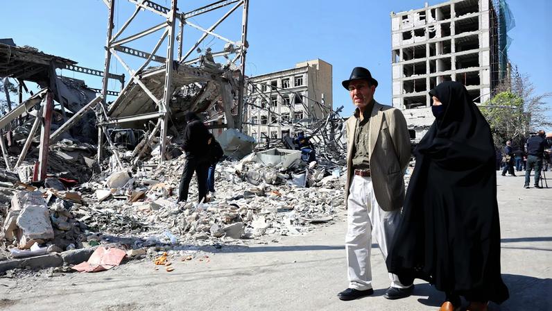People walk past debris in the aftermath of a strike on a police station, amid the U.S.-Israeli conflict with Iran, in Tehran, Iran, March 4, 2026. Majid Asgaripour/WANA (West Asia News Agency) via REUTERS