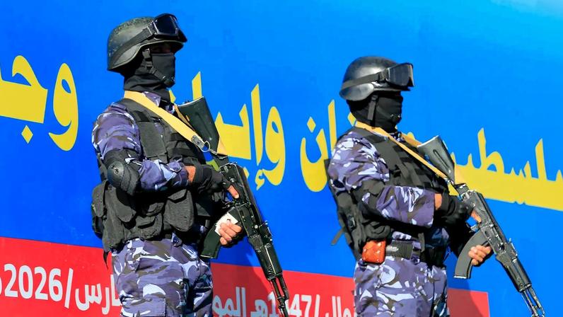 Security personnel stand guard as Houthi supporters rally in solidarity with Iran and Lebanon in Sanaa, Yemen, on March 27.