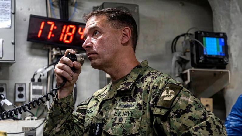 U.S. Navy Admiral Brad Cooper, commander of U.S. Central Command, makes an announcement aboard Nimitz-class aircraft carrier USS Abraham Lincoln in the Arabian Sea February 7, 2026. U.S. Navy/Mass Communication Specialist 2nd Class Sonny Escalante/Handout via REUTERS