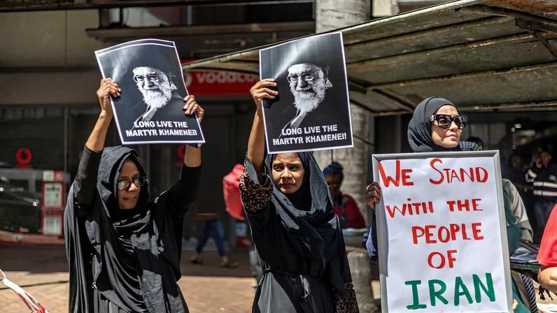 Protesters hold portraits of Iran’s late supreme leader, Ayatollah Ali Khamenei, while gathering during a solidarity protest outside the U.S. Consulate in Durban, South Africa, on March 3.