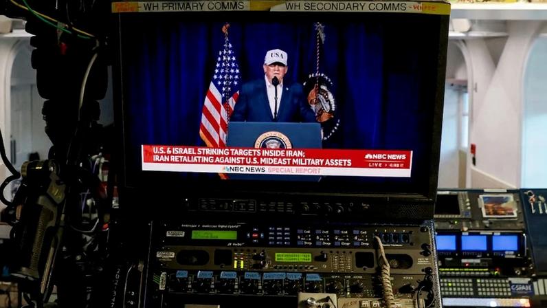 An NBC News live feed airs a clip from a Truth Social video announcement by U.S. President Donald Trump, seen in the White House in Washington on Feb. 28. Anna Moneymaker/Getty Images