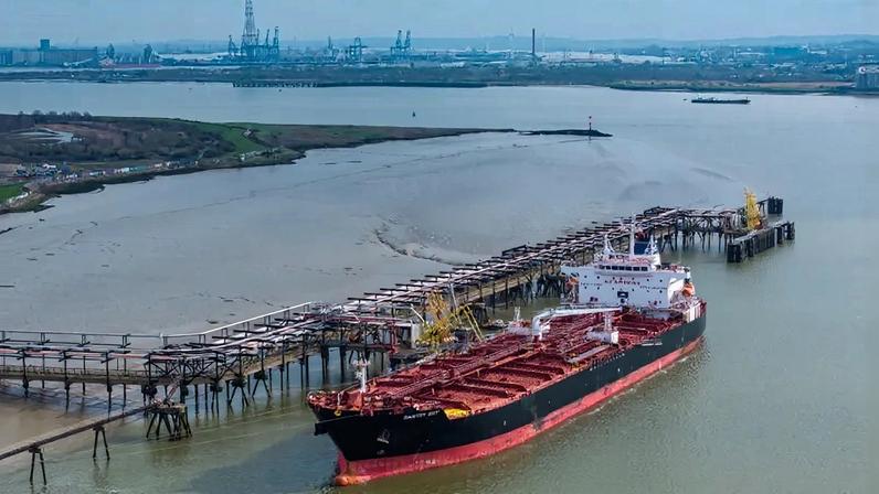 An oil tanker unloads its cargo at Navigator Terminals, an oil storage depot along the River Thames, in London on March 10.