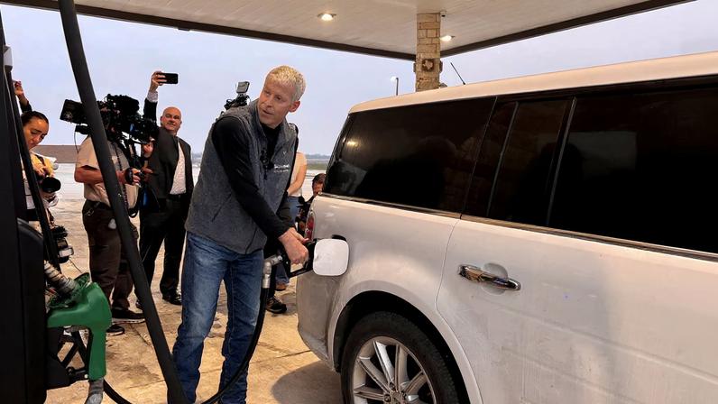 U.S. Energy Secretary Chris Wright pumps gas and speaks with customers at a gas station in Corpus Christi, Texas