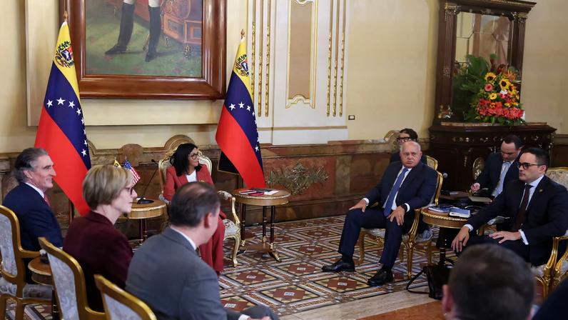 Venezuela's interim President Delcy Rodriguez meets with U.S. Interior Secretary Doug Burgum, with Venezuela's Interior Minister Diosdado Cabello sitting in the room, in Caracas, Venezuela, March 4, 2026. REUTERS/Leonardo Fernandez Viloria