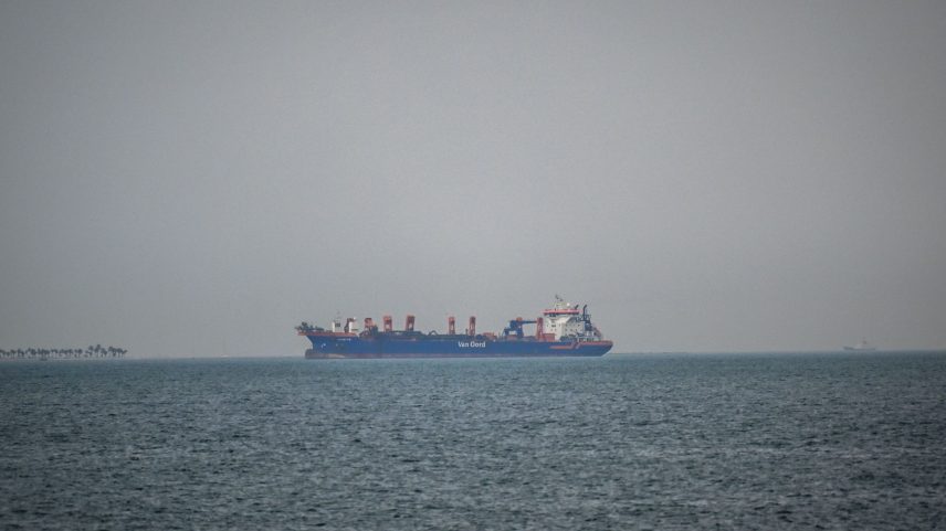 A commercial ship is viewed anchored off the coast of the United Arab Emirates, in the Strait of Hormuz.