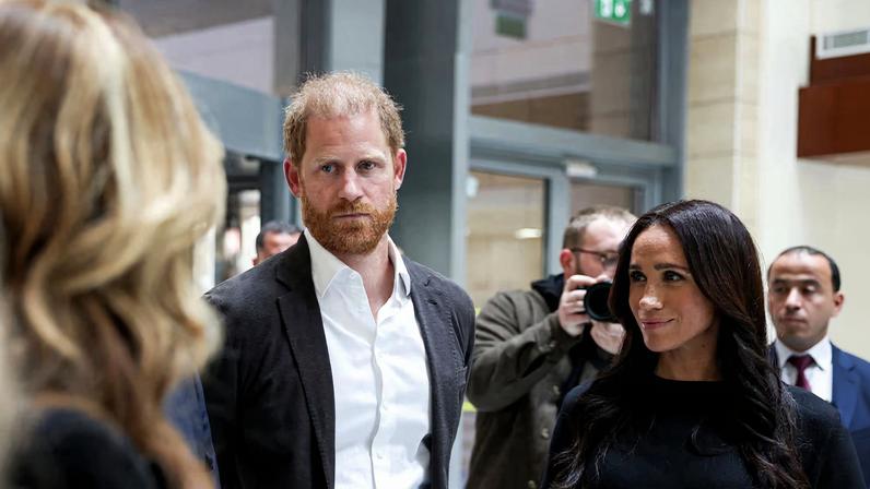 Britain's Prince Harry and Meghan, the Duchess of Sussex, listen as they visit the King Hussein Cancer Center accompanied by a delegation from the World Health Organization in Amman, Jordan, February 26, 2026.