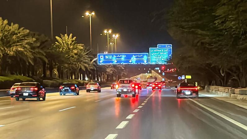 Vehicles drive along a street near the Diplomatic Quarter, following drone strikes that hit the U.S. embassy compound and were intercepted by Saudi air defences, according to the Defence Ministry, in Riyadh, Saudi Arabia, March 3, 2026. Picture taken with a mobile phone.