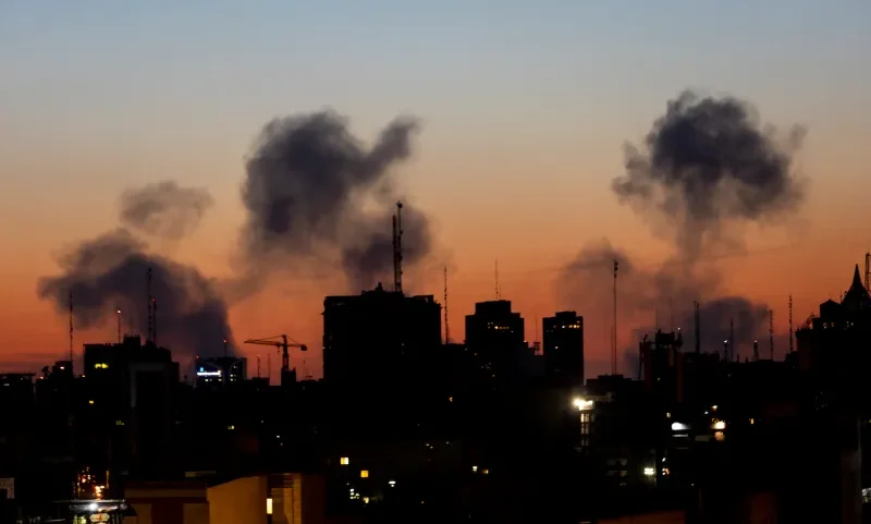 Several plumes of smoke rise from a recent airstrike in Tehran.