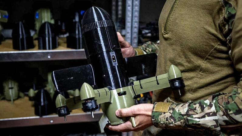 A Ukrainian soldier holds an interceptor drone used to protect against Russian drone attacks