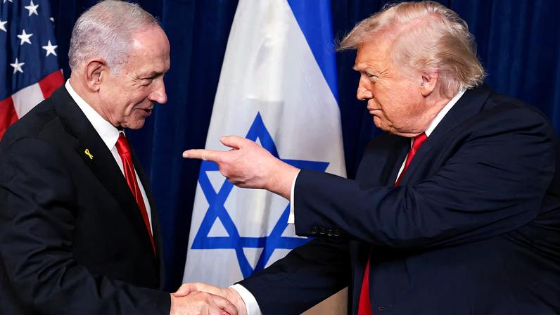 U.S. President Donald Trump points his finger towards Israeli Prime Minister Benjamin Netanyahu as they shake hands during a press conference after meeting at Trump’s Mar-a-Lago club in Palm Beach.