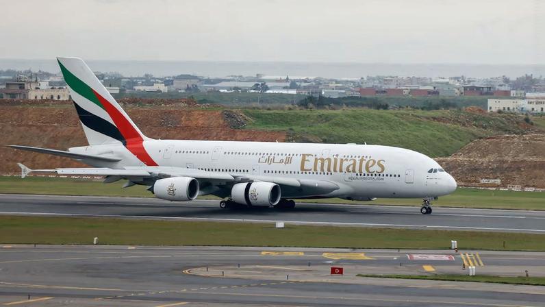 An Emirates flight departing from Dubai lands at Taoyuan International Airport in Taoyuan