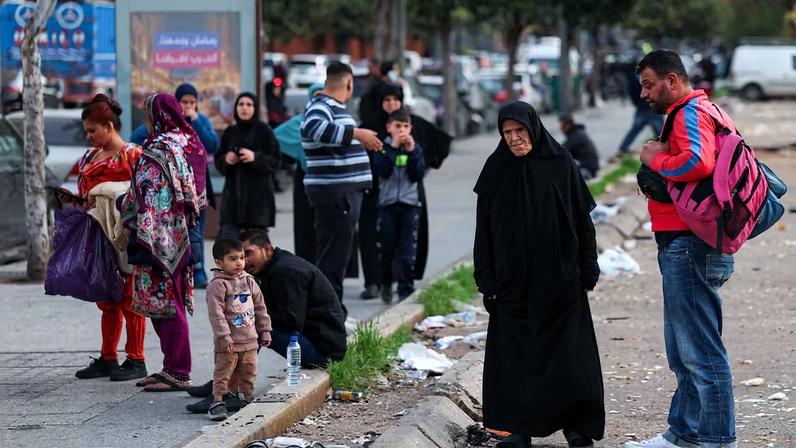 People gather after an evacuation order, following an escalation between Hezbollah and Israel, amid the U.S.-Israeli conflict with Iran, in central Beirut, Lebanon, March 12, 2026. REUTERS/Claudia Greco