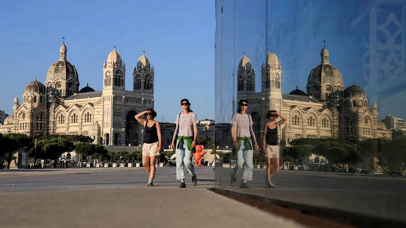 Summer visitors explore Marseille’s coast and landmarks